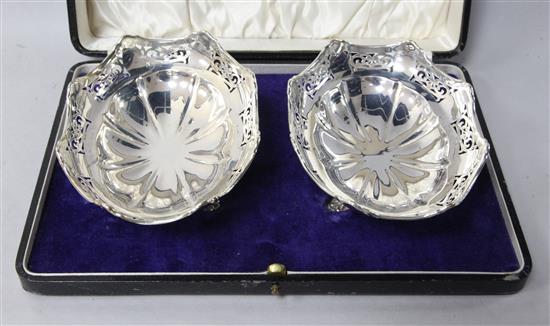 A cased pair of George V silver oval pierced bon bon dishes by Joseph Gloster Ltd, 14cm.
